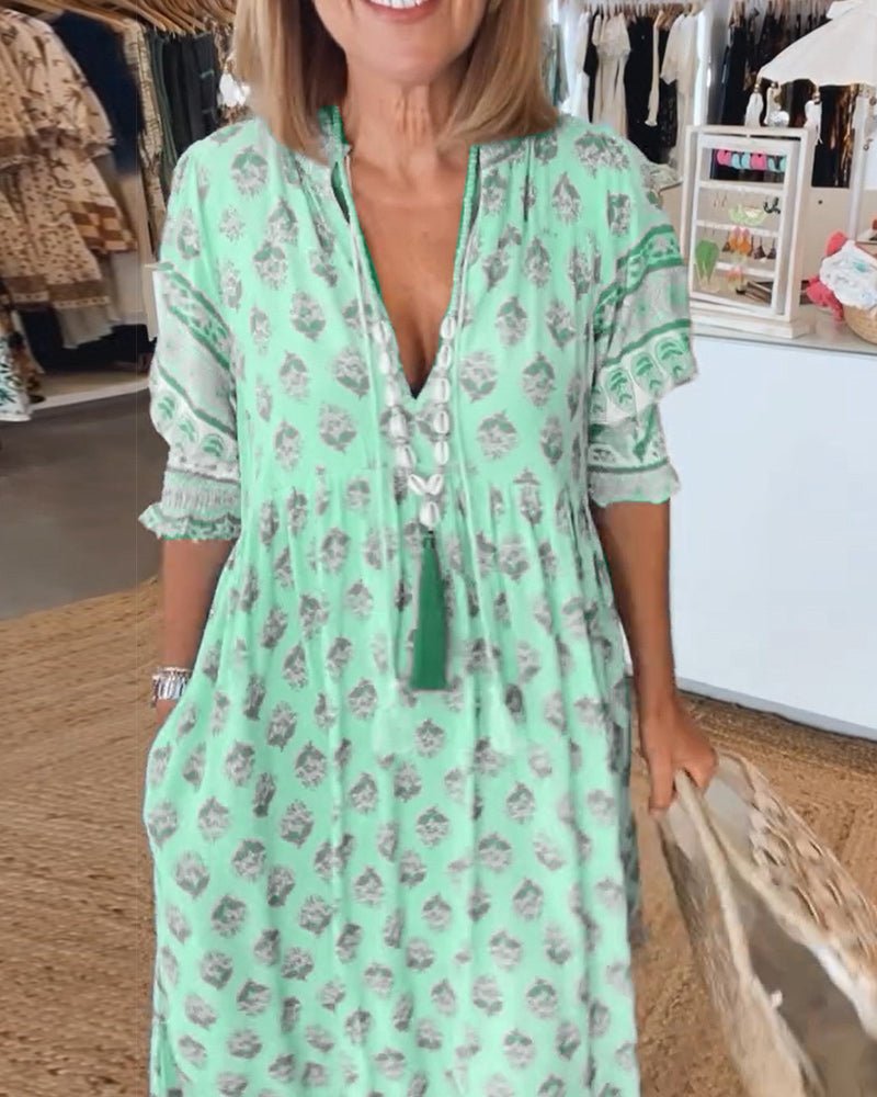 MANA | MIDILANGE CHIQUE FLORALEN JURK MET V-HALS